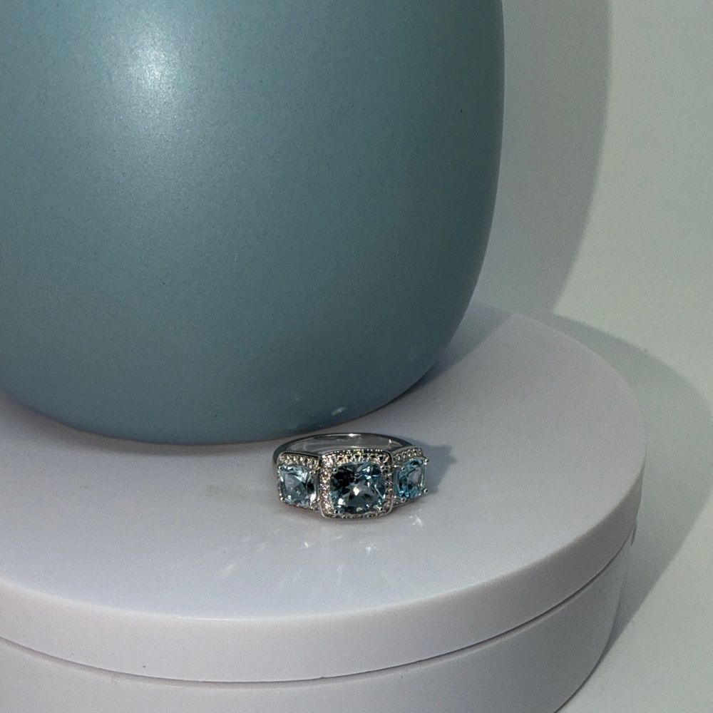 Blue topaz and white diamond ring